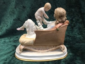 Stamped On Base And Signed By Artist Redwell. This Is A Fine Example Of 20th Century Capodimonte Artwork In Hand Paste Porcelain. Exhibited At The Lord Hill Museum. A Lady Reclining On A Chaise Longe Holding Her Child In The Air.