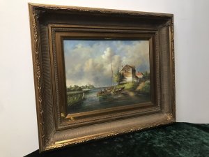 Original Oil Painting Coastal Boating Scene By Artist J Elliot Sail Boat And Inflatable Boat With 5 Figures Detailed House In The Foreground And Windmill In The Landscape Background Stunning Perspective With Great Detail Beautifully Painted Thought To Be Somewhere In Norfolk Oil On Board Set In Gilt Frame Signed By Artist J Elliot Dimensions In Inches Height 20” Width 24”