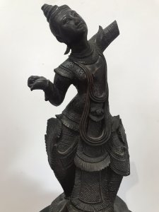 Antique Wood Carving Thai Buddha Figural Female Statue Fine Carved Details Interesting Hardwood Sculpture On Wood Base Genuine Antiquity 19th Century Sculpture Please Note- Right Arm Missing, Fingers Missing Off Left Hand, Component Missing On Back. All Due To Age Of The Piece. Adds To Charm Of The Item Dimensions In Inches Height 19” Width 7.5” Weight Approx 5KG