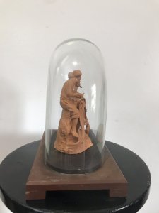 Victorian Terracotta Sculpture ‘Fisherman Mending His Net’ Signed S NO GRASSO. Fisherman Sits Smoking A Pipe Bare Foot On A Rock Whilst Mending His Fishing Net. Lady With Basket Over Her Shoulder Stands Taking To The Fisherman. Terracotta Sculpture In Glass Dome On Wooden Plinth Lovely Condition And Charming Subject Circa 1890 Paris Signed On The Back By The Artist Dimensions In Inches Height 9” Width 9.5”