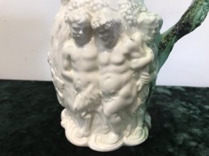 Classical Antique Greek Mythology Rare Coleport Water Jug Front Side~ Two Centaurs Leading Away A Man The Handle Is A Grape Vine With Dark Green Lustre Glaze The Reverse Side ~ Is A Cherub Riding An Oxen Guided By A Wise Man Made In Creme Hand Paste Porcelain Stunning Mythological Piece Circa 1840 Colouring - White In Perfect Condition Collectors Item Dimensions In Inches Height Width