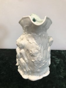 Classical Antique Greek Mythology Rare Coleport Water Jug Front Side~ Two Centaurs Leading Away A Man The Handle Is A Grape Vine With Dark Green Lustre Glaze The Reverse Side ~ Is A Cherub Riding An Oxen Guided By A Wise Man Made In Creme Hand Paste Porcelain Stunning Mythological Piece Circa 1840 Colouring - White In Perfect Condition Collectors Item Dimensions In Inches Height Width