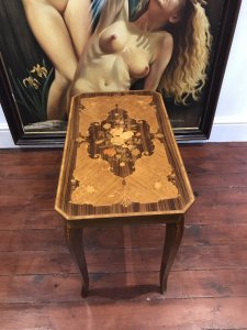 Italian Floral Marquetry Inlaid Coffee Table With Satinwood, Rosewood, Elm And Kingwood Hand Inlaid Floral Top. Beautifully Shaped Canted Corners And Cross Banded Edges Lift Up Lid For Storage Standing On Sabre Shaped Legs Stunning Piece Plays Doctor Zhivago Tune When Lid Is Opened Lovely Musical Piece Dimensions In Inches Height 21.5” Width 25.5” Depth 14.5”