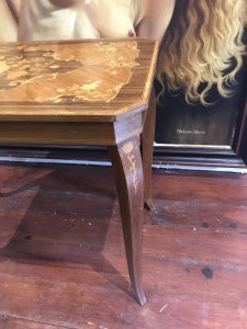 Italian Floral Marquetry Inlaid Coffee Table With Satinwood, Rosewood, Elm And Kingwood Hand Inlaid Floral Top. Beautifully Shaped Canted Corners And Cross Banded Edges Lift Up Lid For Storage Standing On Sabre Shaped Legs Stunning Piece Plays Doctor Zhivago Tune When Lid Is Opened Lovely Musical Piece Dimensions In Inches Height 21.5” Width 25.5” Depth 14.5”