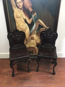 Fine Pair Regency Style Carved Elm Hall Seats Ornate Acanthus Leaf Carvings On Backs And Sides Cabriole Legs With Stunning Claw And Ball Feet Heavy Quality Antique Reproductions Intricate Carvings All Around Highly Polished Patina Craftsman Made Dimensions In Inches Height 37” Width 16” Depth 19.5”